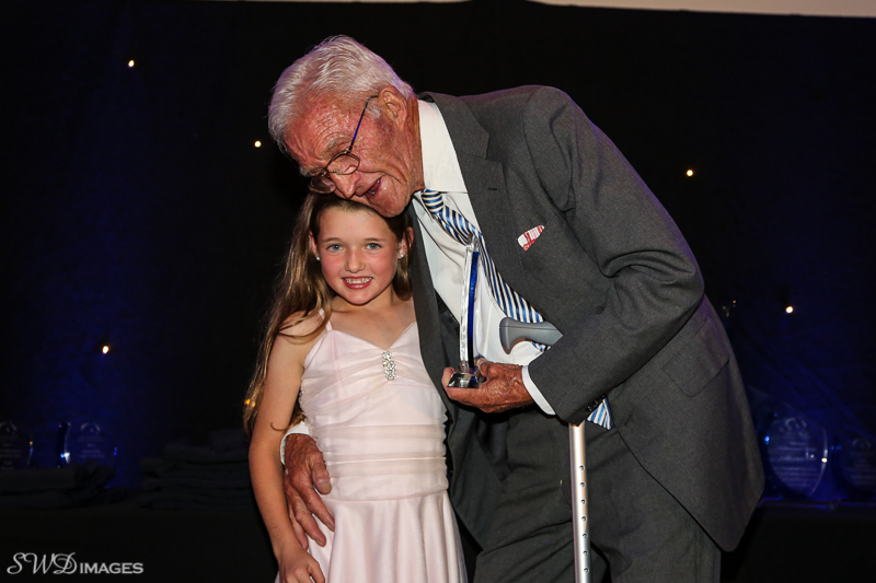 Elizabeth Ratlor (8) presenting Wyastt "Bunty" Thompson with his award